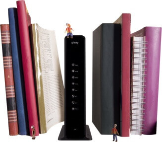 Wireless Gateway sandwiched between books on a shelf