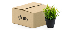 Moving box with Xfinity logo next to plant