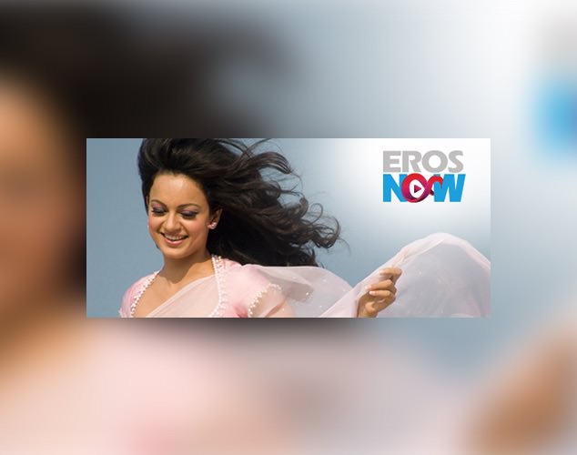 Woman next to Eros Now logo