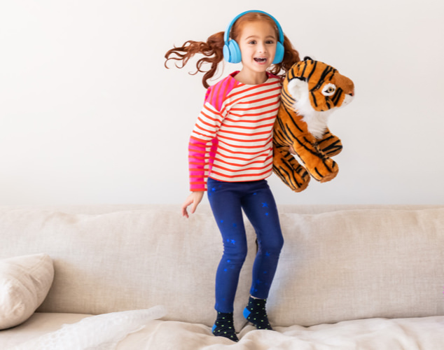 Child jumping with tiger